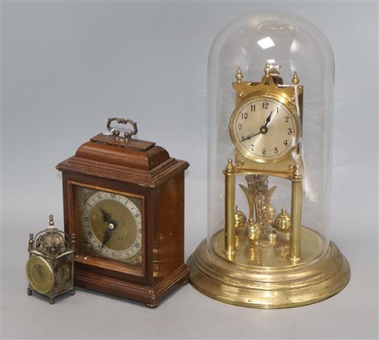 A gilt brass torsion clock under glass dome (a.f), an Elliot mantel clock and a miniature lantern clock